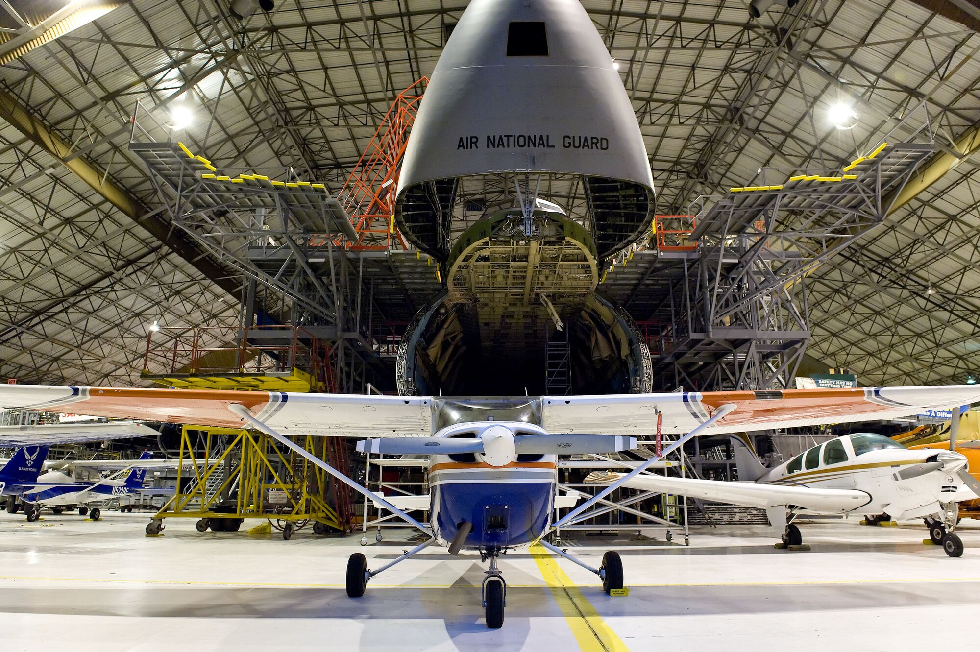 Aero Club and Civil Air Patrol aircraft are parked around a C-5 Galaxy inside hangar 711 Oct. 30, 2012, at Dover Air Force Base, Del. The aircraft were placed in the hangar prior to Hurricane Sandy?s arrival. (U.S. Air Force photo by Roland Balik)