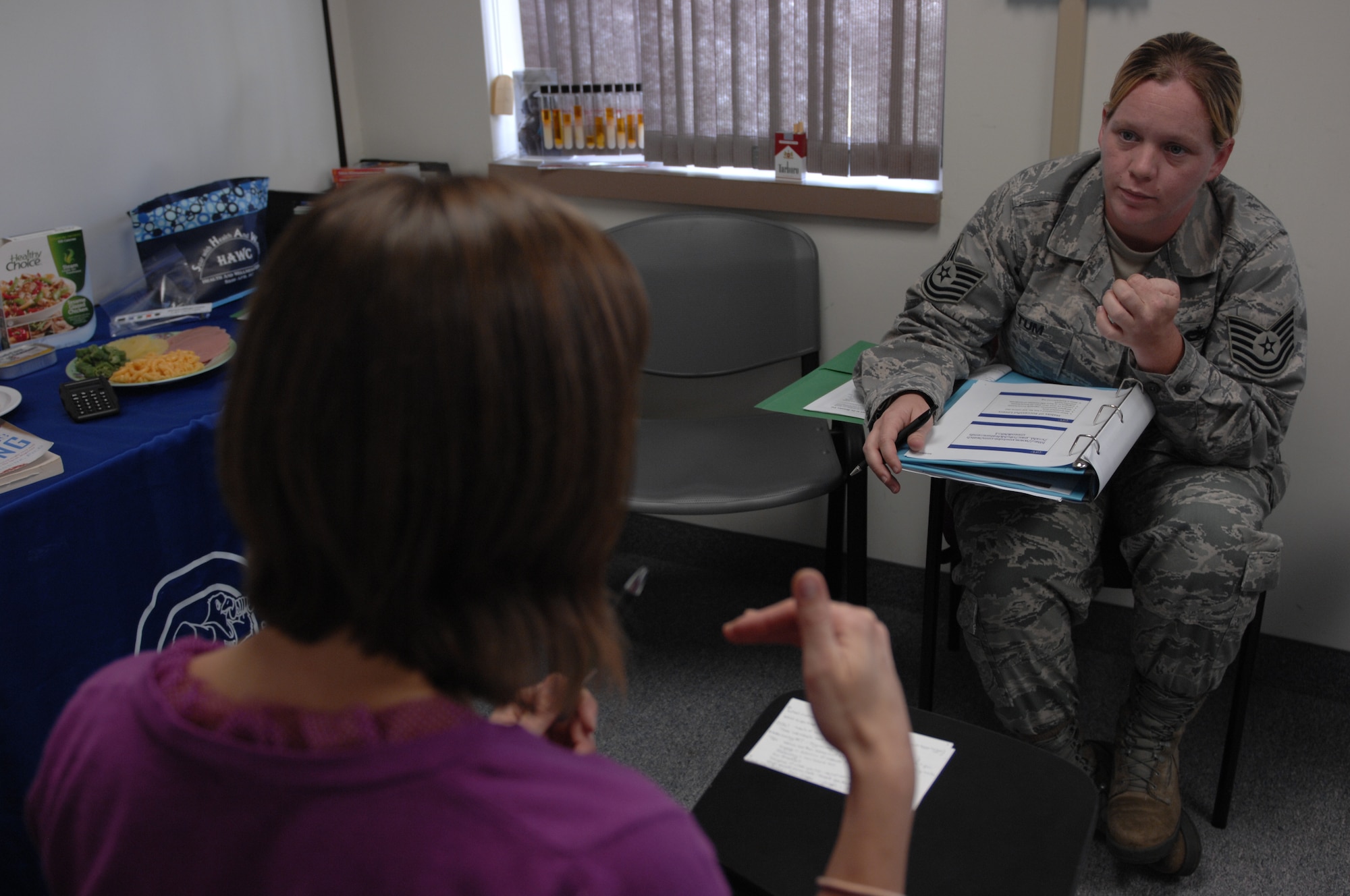 Janine Reinholtz, 20th Medical Group community dietitian at the Health and Wellness Center, teaches Tech. Sgt. Mindy Altum, 20th Component Maintenance Squadron unit training monitor, nutrition information during “Better Body, Better Health” at Shaw Air Force Base, S.C. Oct. 15, 2012. Altum said she wanted to learn more about nutrition to live a healthier life style. The program teaches better behavior habits, nutrition and fitness to help service members and their dependents manage their weight. (U.S. Air Force photo by Airman 1st Class Krystal M. Jeffers/Released)