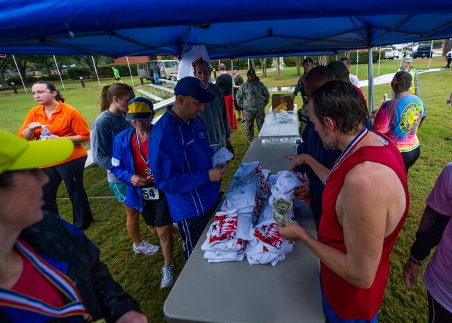 Participants rest after the fourth annual Run the Runway 5K event honoring retired Brig. Gen. Thomas Mikolajcik, Oct. 27, 2012, at Joint Base Charleston - Air Base, S.C. The 437th Airlift Wing hosted the event which was open to all military, Department of Defense civilians and the local community. (U.S. Air Force photo/ Airman 1st Class George Goslin) 