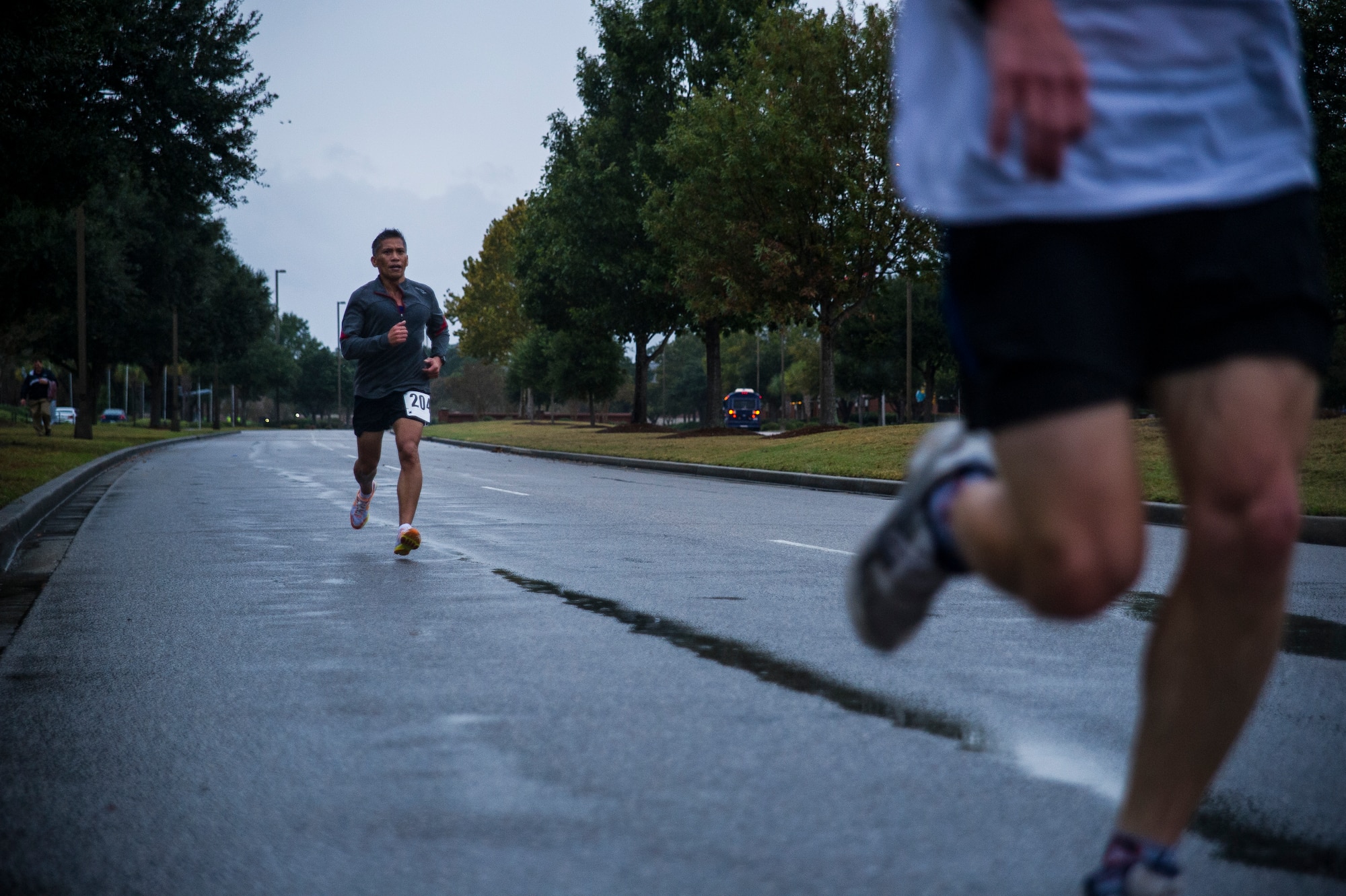 Chief Master Sgt. Neil Mann, 315th Maintenance Squadron fabrication flight chief, runs toward  the finish line of the fourth annual Run the Runway 5K event honoring retiring Brig. Gen. Thomas Mikolajcik Oct. 27, 2012, at Joint Base Charleston - Air Base, S.C. The 437th Airlift Wing hosted the event which was open to all military, Department of Defense civilians and the local community. (U.S. Air Force photo/ Airman 1st Class George Goslin)