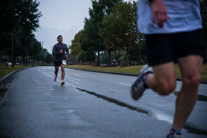 Chief Master Sgt. Neil Mann, 315th Maintenance Squadron fabrication flight chief, runs toward  the finish line of the fourth annual Run the Runway 5K event honoring retiring Brig. Gen. Thomas Mikolajcik Oct. 27, 2012, at Joint Base Charleston - Air Base, S.C. The 437th Airlift Wing hosted the event which was open to all military, Department of Defense civilians and the local community. (U.S. Air Force photo/ Airman 1st Class George Goslin)
