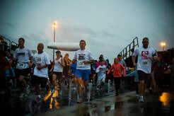 Participants start the fourth annual Run the Runway 5K event honoring retired Brig. Gen. Thomas Mikolajcik Oct. 27, 2012, at Joint Base Charleston - Air Base, S.C. The 437th Airlift Wing hosted the event which was open to all military, Department of Defense civilians and the local community. (U.S. Air Force photo/ Airman 1st Class George Goslin) 