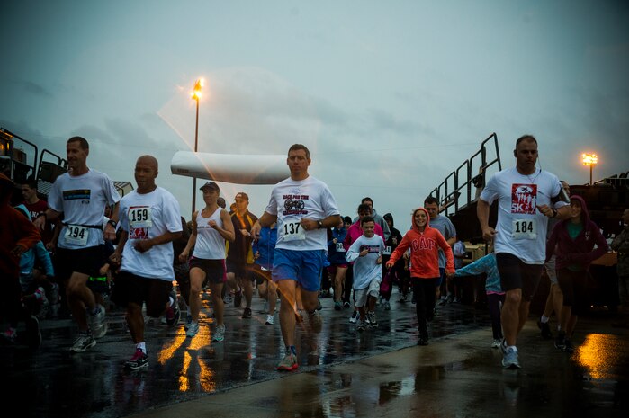 Participants start the fourth annual Run the Runway 5K event honoring retired Brig. Gen. Thomas Mikolajcik Oct. 27, 2012, at Joint Base Charleston - Air Base, S.C. The 437th Airlift Wing hosted the event which was open to all military, Department of Defense civilians and the local community. (U.S. Air Force photo/ Airman 1st Class George Goslin) 
