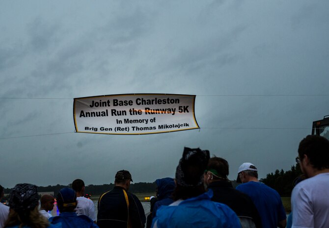 Participants gather at the starting line for the fourth annual Run the Runway 5K event honoring retired Brig . Gen. Thomas Mikolajcik Oct. 27, 2012, at Joint Base Charleston - Air Base, S.C. The 437th Airlift Wing hosted the event which was open to all military, Department of Defense civilians and the local community. (U.S. Air Force photo/ Airman 1st Class George Goslin)