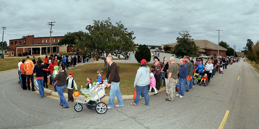 Parents and children wait in line for "trunk-or-treat" at Shaw Air Force Base, S.C. Oct. 12, 2012. An estimated 2,000 people arrived for the event. This was the fourth annual Halloween Boo Bash. (U.S. Air Force photo by Airman Basic Neil D. Warner/Released)