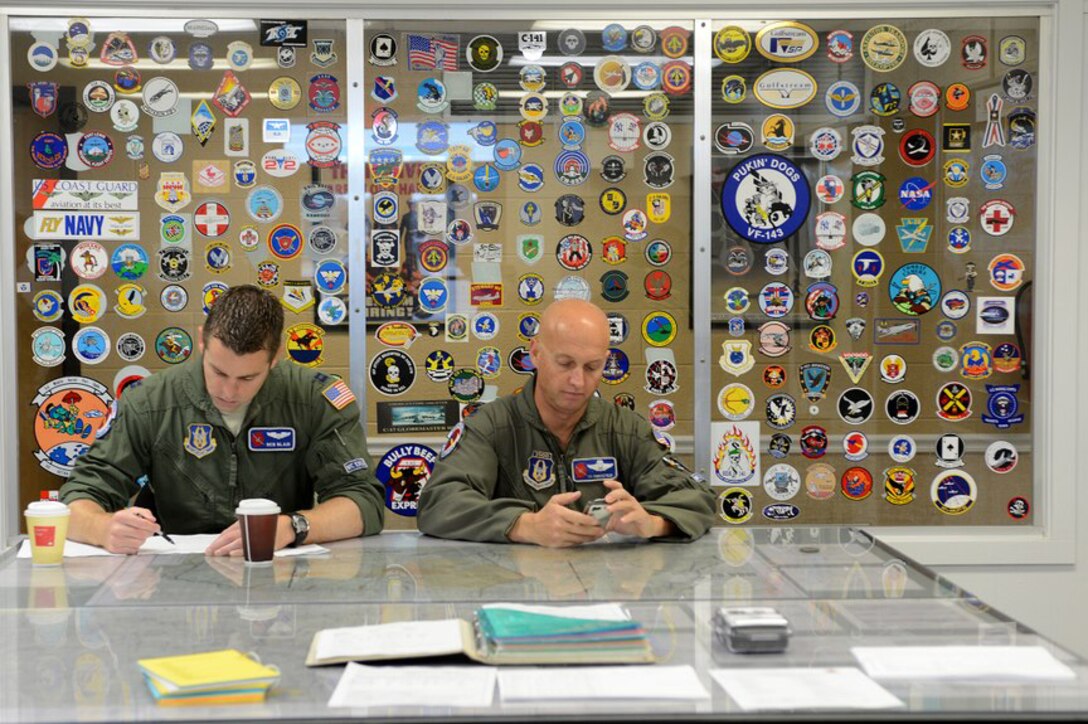 Capt. Ben Blair (left) and Lt. Col. Ty Piercefield, from the 53rd Weather Reconnaissance Squadron, prepare for a weather reconnaissance mission Oct. 29, 2012, at Hunter Army Airfield, Ga. The 53rd WRS conducted weather reconnaissance missions in preparation for Hurricane Sandy making landfall along the Eastern coastline of the United States. (U.S. Air Force photo/Staff Sgt. Jason Robertson)