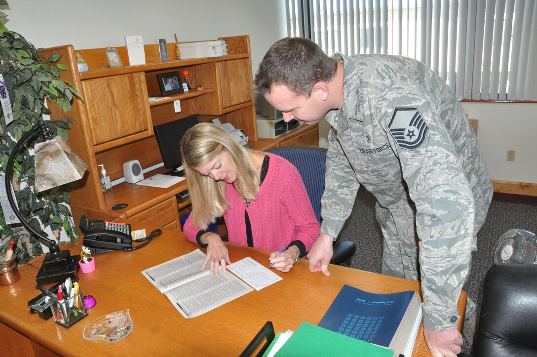 MSgt. Clifton Matthews, CFC key worker, helps Pamela Jordan, Airman and Family Services Flight Chief, 45th Force Support Squadron, fill out a CFC form.

Photo by 2nd Lt. Alicia Wallace