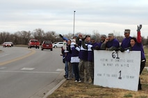 MINOT AIR FORCE BASE, N.D. -- Team Minot members stand together as advocates representing victims of maltreatment in support of domestic violence awareness month here, Oct. 19. Although the issue is recognized during one month out of the year, the Family Advocacy Program provides continuous outreach, prevention and support to all Minot members and their families. (U.S. Air Force photo/Kiley Swopes)
