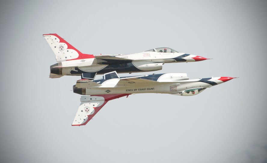 Two F-16 Thunderbird Fighting Falcons perform aerial acrobatics together during the Moody Air Force Base, Ga., Legacy of Liberty Open House air show Oct. 26, 2012. The Thunderbirds showcased the precision and maneuverability of the F-16 for nearly 40,000 air show guests. (U.S. Air Force photo by Senior Airman Douglas Ellis/Released)
