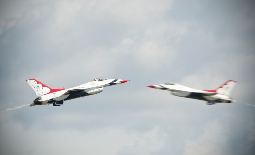 Two F-16 Thunderbird Fighting Falcons perform aerial acrobatics together during the Moody Air Force Base, Ga., Legacy of Liberty Open House air show Oct. 26, 2012. During the 2012 season, the Thunderbirds will spend more than 200 days on the road representing Airmen during its 59th year. (U.S. Air Force photo by Senior Airman Douglas Ellis/Released)
