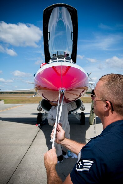 A member of the U.S. Air Force Thunderbirds Flight Demonstration team polishes an F-16 Thunderbird Fighting Falcon in preparation for the Moody Air Force Base, Ga., Legacy of Liberty Open House air show Oct. 26, 2012. This year’s air show was showcased to an audience of nearly 40,000 people. (U.S. Air Force photo by Senior Airman Douglas Ellis/Released)
