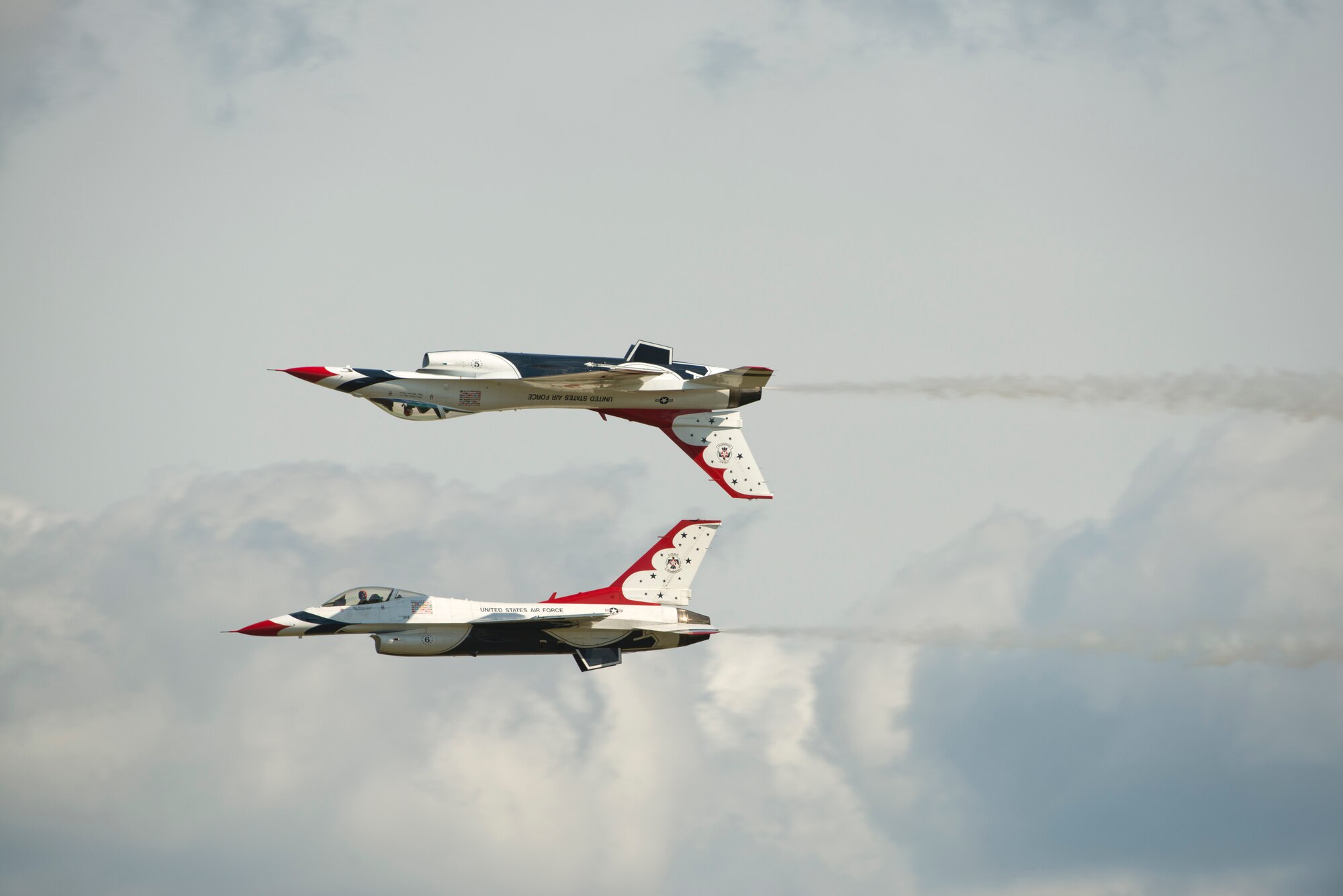 Two F-16 Thunderbird Fighting Falcons perform aerial acrobatics together during the Moody Air Force Base, Ga., Legacy of Liberty Open House air show Oct. 26, 2012. The Thunderbirds showcased the precision and maneuverability of the F-16 for nearly 40,000 air show guests. (U.S. Air Force photo by Senior Airman Douglas Ellis/Released)
