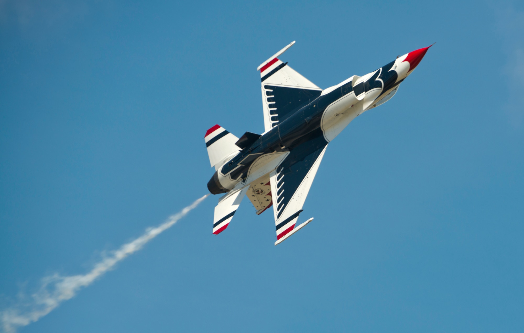 An F-16 Thunderbird Fighting Falcon with the U.S. Air Force Thunderbirds Flight Demonstration Team flies through the sky during the Moody Air Force Base, Ga., Legacy of Liberty Open House air show Oct. 26, 2012. Millions of people have witnessed the Thunderbirds’ demonstrations, which reflect the pride, professionalism and dedication of hundreds of thousands of Airmen serving at home and abroad. (U.S. Air Force photo by Senior Airman Douglas Ellis/Released)
