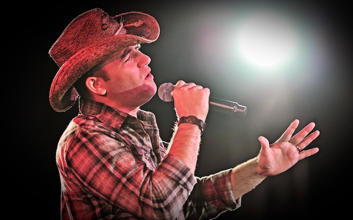 Staff Sgt. Tiry Crane, from Little Rock Air Force Base, performs for the judges and a crowd of more than 200 at the Scott Air Force Base club Oct. 25, 2012. Ten performers participated in the 2012 AMC Icon, a contest similar to the famed American Idol in which contestants competed for cash prizes and a spot to perform in the U.S. Air Force Tops in Blue group. 1Lt Nicole White took the top prize with Staff Sgt. Tiry Crane as the runner up and TSgt Doug Boren in third place. (U.S. Air Force photo/ Staff Sgt. Ryan Crane)