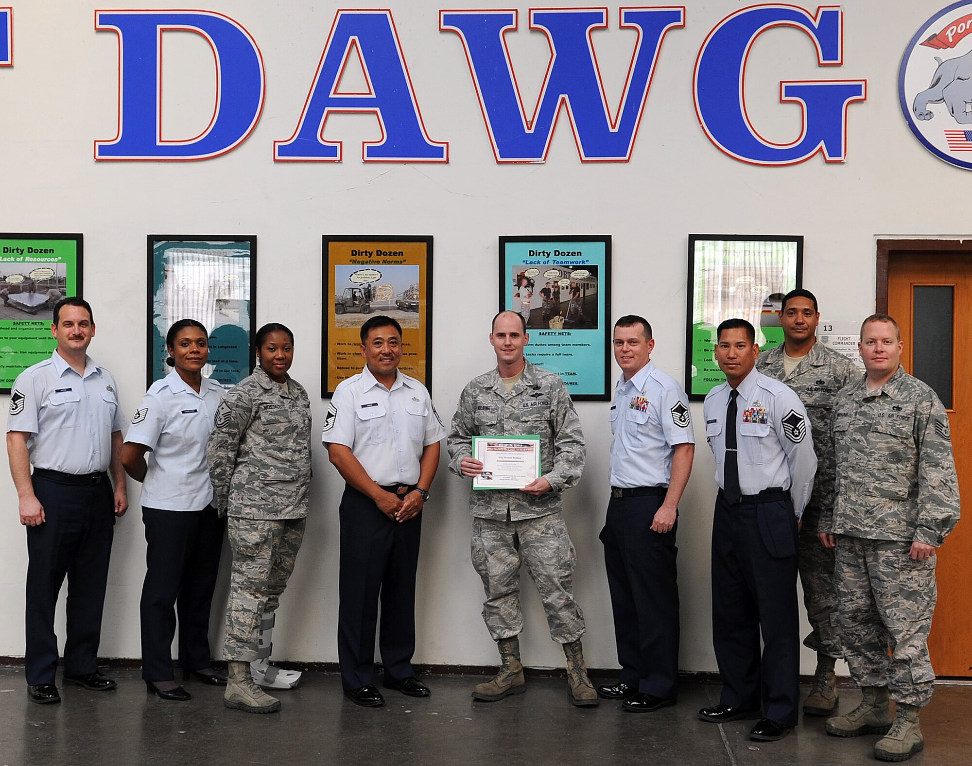 Staff Sgt. Brandt Bolding, 728th Air Mobility Squadron,  receives the Unsung Hero Award from the Incirlik Top 3 organization Oct. 29, 2012, at Incirlik Air Base, Turkey. The Top 3 presents the Unsung Hero Award monthly to an Airman who demonstrates superior job performance and exceptional leadership. (U.S. Air Force photo by Senior Airman Daniel Phelps/Released)