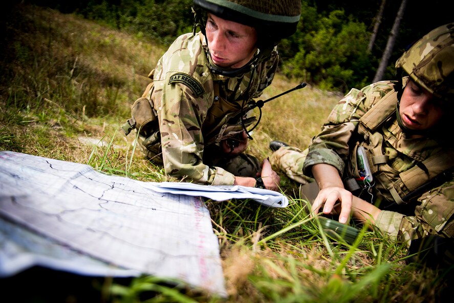 British army Flight Lieutenant Steve Burr, left, and Lance Cpl. David Scott, both joint terminal attack controllers with the 7th Armored Brigade, review target information while communicating with an A-10C Thunderbolt II pilot during Exercise Flying Rhino in South Georgia, Oct. 23, 2012. While stateside, the JTACs trained with the 74th and 75th Fighter Squadrons at Moody Air Force Base, Ga., and U.S. Marines at Cherry Point, N.C. (U.S. Air Force photo by Staff Sgt. Jamal D. Sutter/Released)  