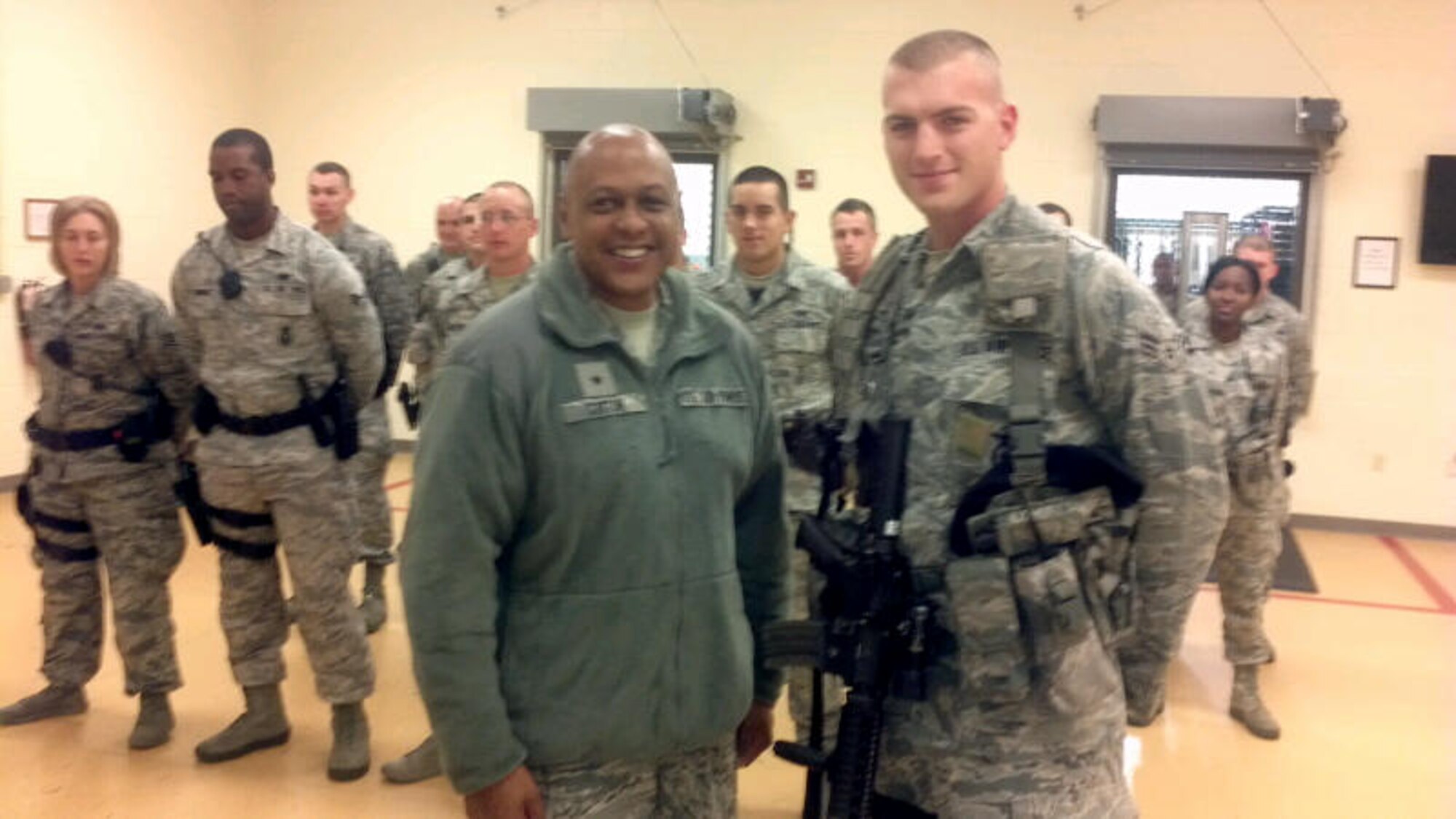 Brig. Gen. Anthony Cotton coins A1C Heath Muller. 
Photo by Brad Swezey