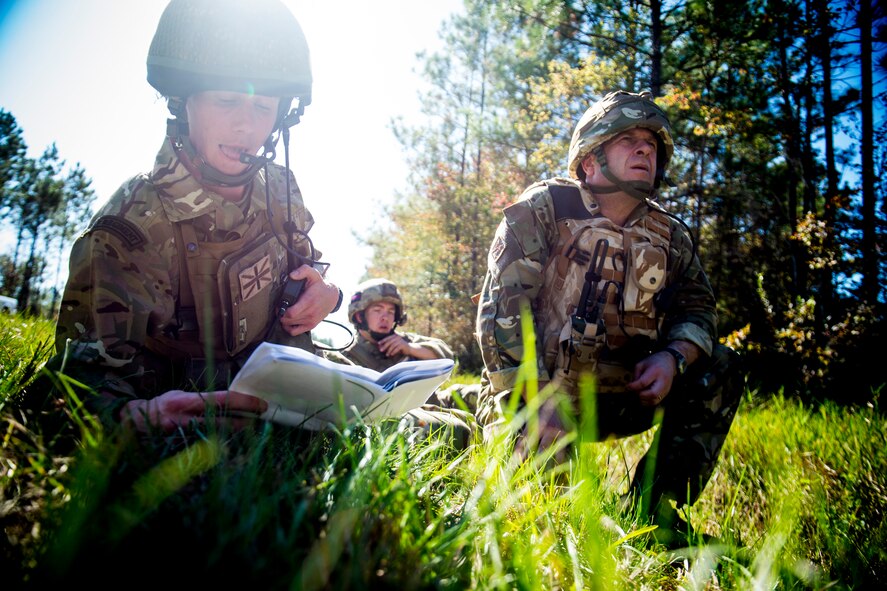 British army Flight Lieutenant Steve Burr, 7th Armored Brigade joint terminal attack controller, Lance Cpl. David Scott, 7th Armored Brigade JTAC, and Royal Air Force Sgt. Peter Kenn, RAF Spadeadam supervisory forward-air controller, conduct close-air support during Exercise Flying Rhino in South Georgia, Oct. 23, 2012. The team worked together with A-10C Thunderbolt II pilots from the 74th and 75th Fighter Squadrons out of Moody Air Force Base, Ga., to perform close-air support familiarization training. (U.S. Air Force photo by Staff Sgt. Jamal D. Sutter/Released)   