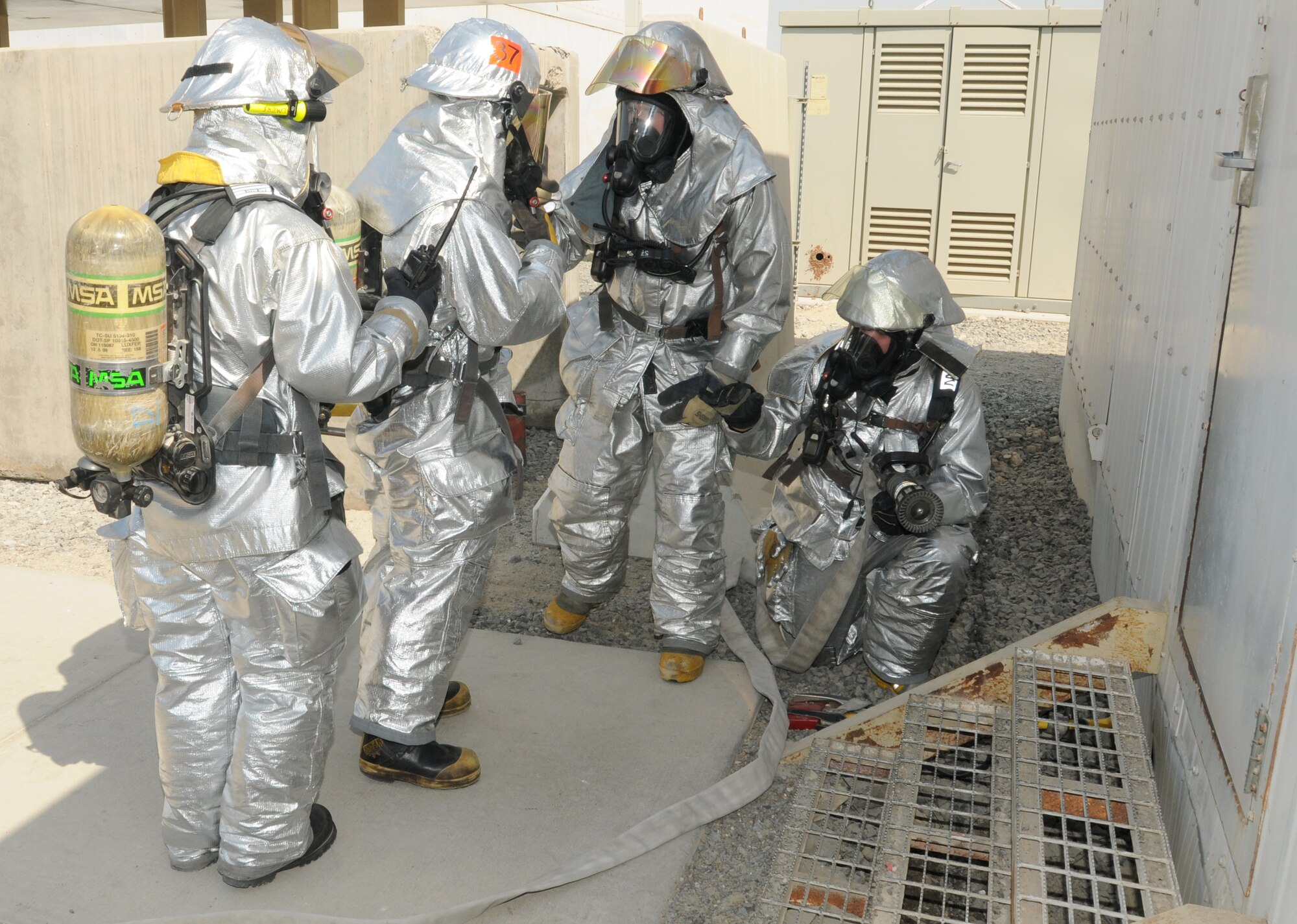 SOUTHWEST ASIA - U.S. Air Force firefighters from the 380th Expeditionary Civil Engineer Squadron Fire Department Station 1 respond to a structure fire scenario during an exercise Oct. 29, 2012. The 380th ECES fire department trains constantly to ensure all firefighters are proficient and meeting mandated requirements. (U.S. Air Force photo/Tech. Sgt. Amanda Savannah)