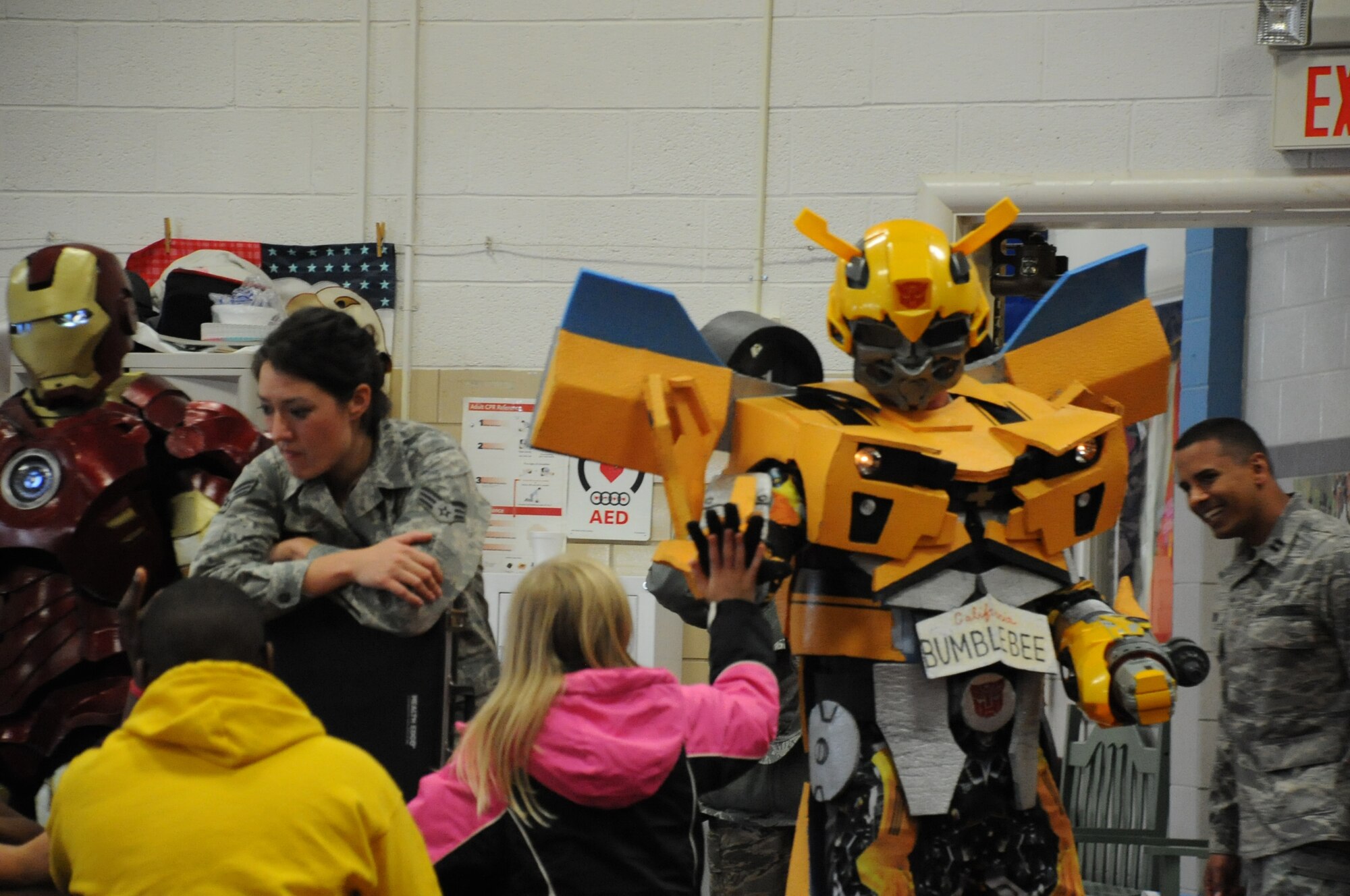 Sixth grade students at Sheppard Elementary got a big surprise during a drug free presentation when Brig. Gen. Michael Fantini, 82d TRW Commander, dressed as Transformers Bumblebee and Technical Sgt. Olsen Betron dressed as Iron Man came out to support Red Ribbon week on Oct. 26. This year's Red Ribbon Week theme is, "The Best Me is Drug Free." (U.S. Air Force Photo/Kimberly Parker). 