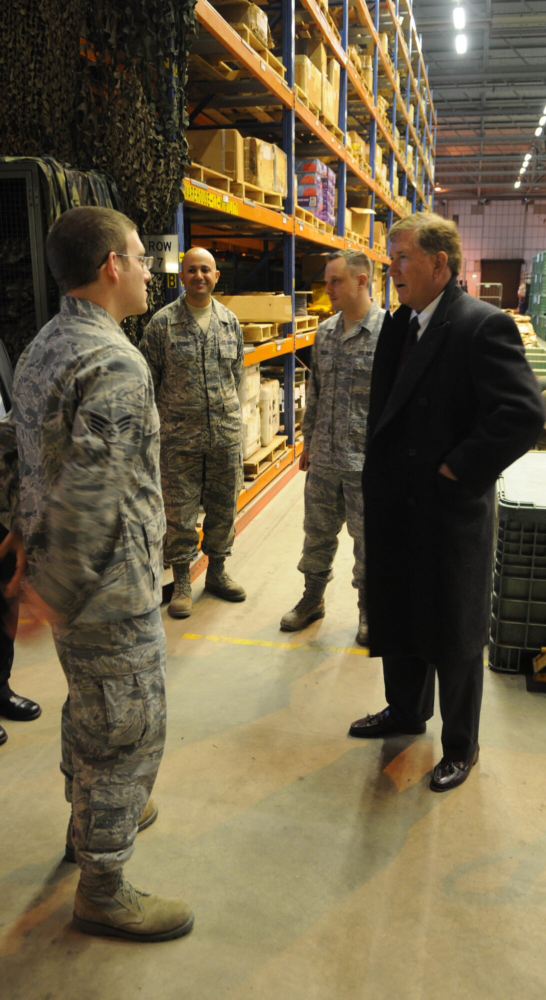Senior Airman Steven Lauzon, 100th Logistics Readiness Squadron Individual Protective Equipment technician, shows Terry Yonkers, Assistant Secretary of Air Force Installations, Environments and Logistics, around the 100th LRS IPE Element Oct. 29, 2012, during a visit to RAF Mildenhall, England. The assistant secretary thanked Airmen for their service and spent a few moments learning about their families, hobbies and how they feel about being stationed in the United Kingdom. Yonkers also visited RAF Lakenheath and is scheduled to visit RAF Alconbury. (U.S. Air Force photo by Staff Sgt. Austin M. May/Released)