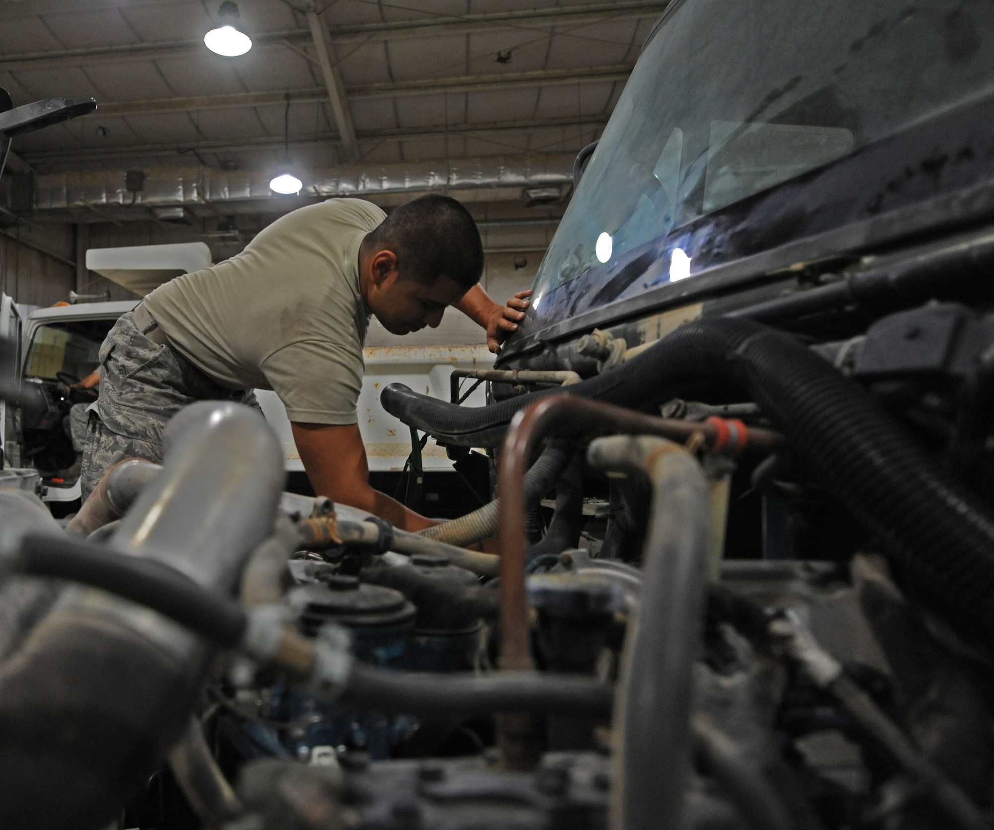 SOUTHWEST ASIA – Senior Airman Patrick Jeffers, 386th Expeditionary Logistics Readiness Squadron vehicle mechanic, prepares to replace an air conditioning unit on a sweeper truck here Oct. 29.  The mechanics can have from one to 35 vehicles in the garage at any given time waiting for maintenance. (U.S. Air Force photo/Staff Sgt. Alexandra M. Boutte)