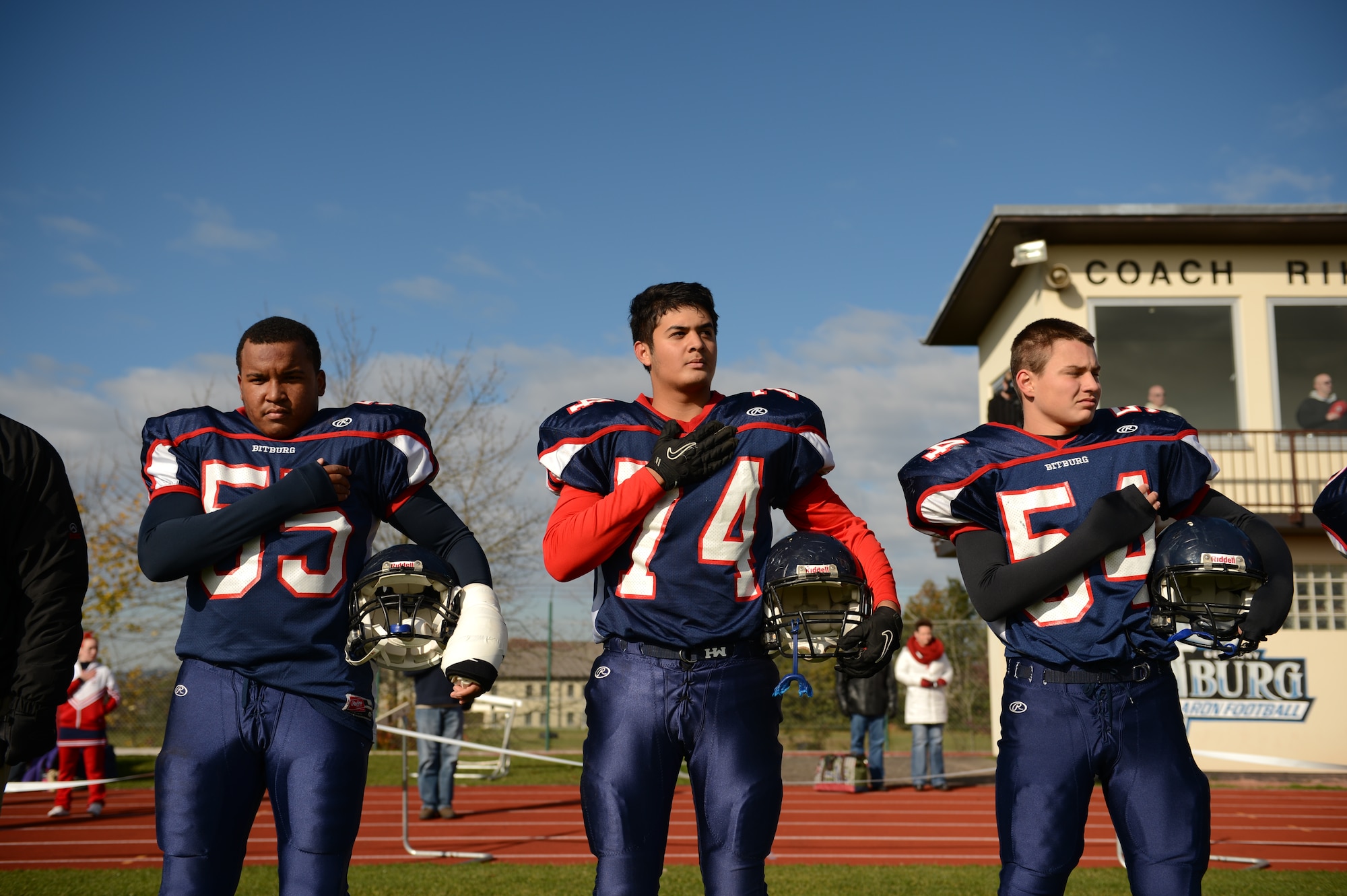 BITBURG ANNEX, Germany – Bitburg Barons players stand for the national anthem before their final home game at Rik Carr Field Oct. 27, 2012. The Barons defeated the Hohenfels Tigers 56 – 14, which earned them a spot in the Department of Defense Dependents Schools Europe Division-II championship game against the Naples Wildcats. (U.S. Air Force photo by Staff Sgt. Nathanael Callon/Released) 
