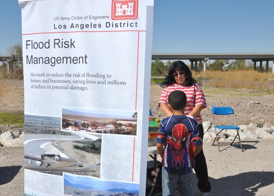 PHOENIX - Ann Palaruan, a member of the U.S. Army Corps of Engineers Los Angeles District, talks with a young attendee during the Tres Rios Nature and Earth Festival held Oct. 27. The Corps joined with other exhibitors for the one-day event to celebrate the project and raise awareness of the recreation opportunities available.