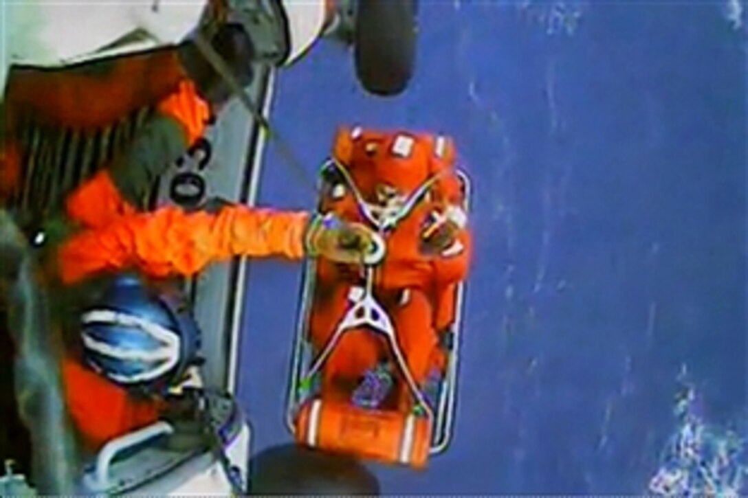 The Coast Guard rescues 14 people from life rafts in the Atlantic Ocean about 90 miles southeast of Hatteras, N.C., Oct. 29, 2012, but two people remain missing. The first MH-60 Jayhawk crew hoisted five people into the aircraft, and a second helicopter rescued nine people. Crews took all to Coast Guard Air Station Elizabeth City, N.C., with no life-threatening conditions.


