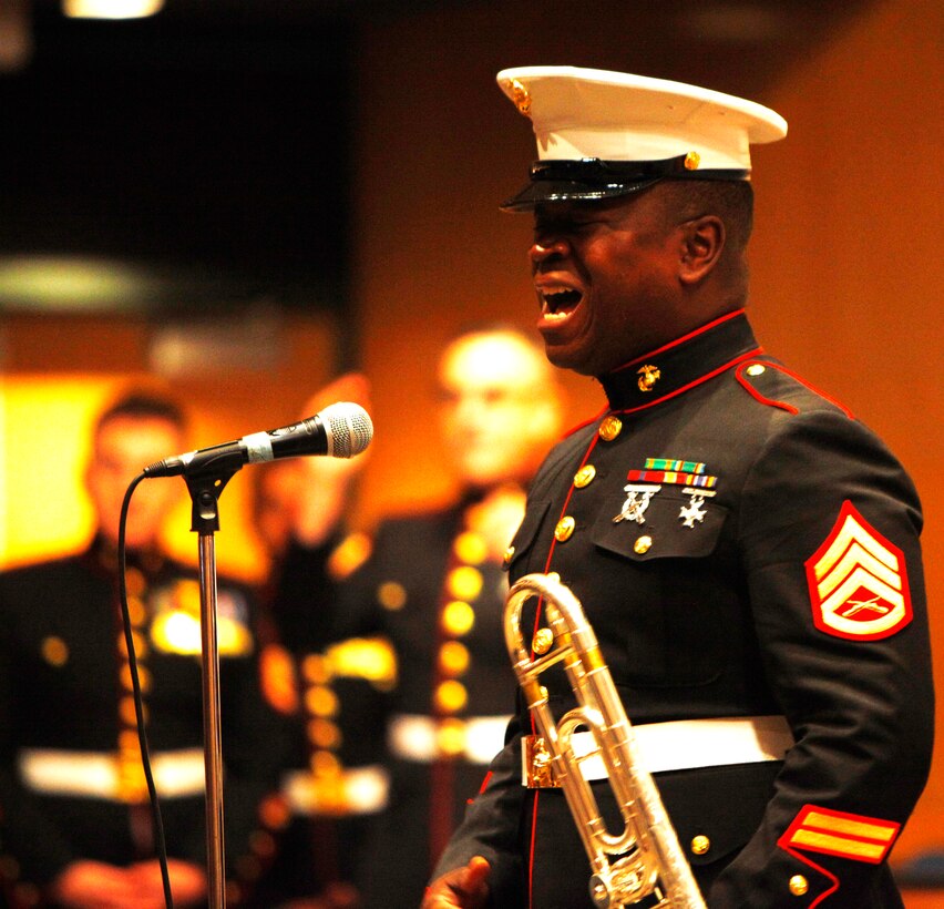 Staff Sgt. Ron Digsby, a trombonist from the Marine Corps Band New Orleans, sings a tune for students at William Floyd High School in Mastic Beach, N.Y., Oct. 25, 2012.  Each year, the Corps’ musicians travel throughout the United States, performing more than 250 concerts, parades and ceremonies, entertaining more than six million people. (U.S. Marine Corps Photo by Cpl. Nana Dannsa-Appiah/Released)