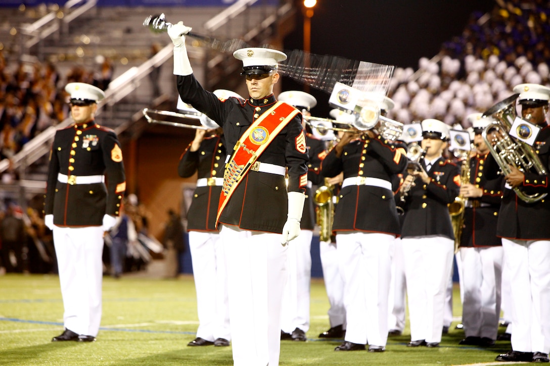Staff Sgt. Ignatius Keogh, drum major of the Marine Corps Band New Orleans, leads the band during the 2012 Newsday Marching Band Festival at Hofstra University in Hempstead, N.Y., Oct. 25, 2012.  Marine Corps recruiters were also present at the festival featuring high school bands and community members from the Long Island, N.Y., region.  (U.S. Marine Corps Photo by Cpl. Nana Dannsa-Appiah/Released)