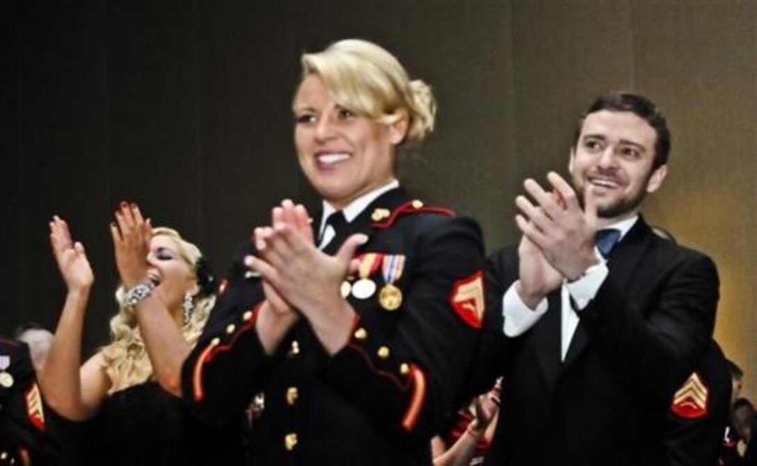 Reserve Marine Sgt. Kelsey DeSantis and Justin Timberlake, a musician and actor, stand to applaud during a ceremony at the Marine Corps Birthday Ball, Nov. 12, 2011 in Richmond, Va. She was the second Marine to ask a celebrity to the ball with a YouTube video. Timberlake’s “Friends with Benefits” co-star was also asked by a Marine. 
