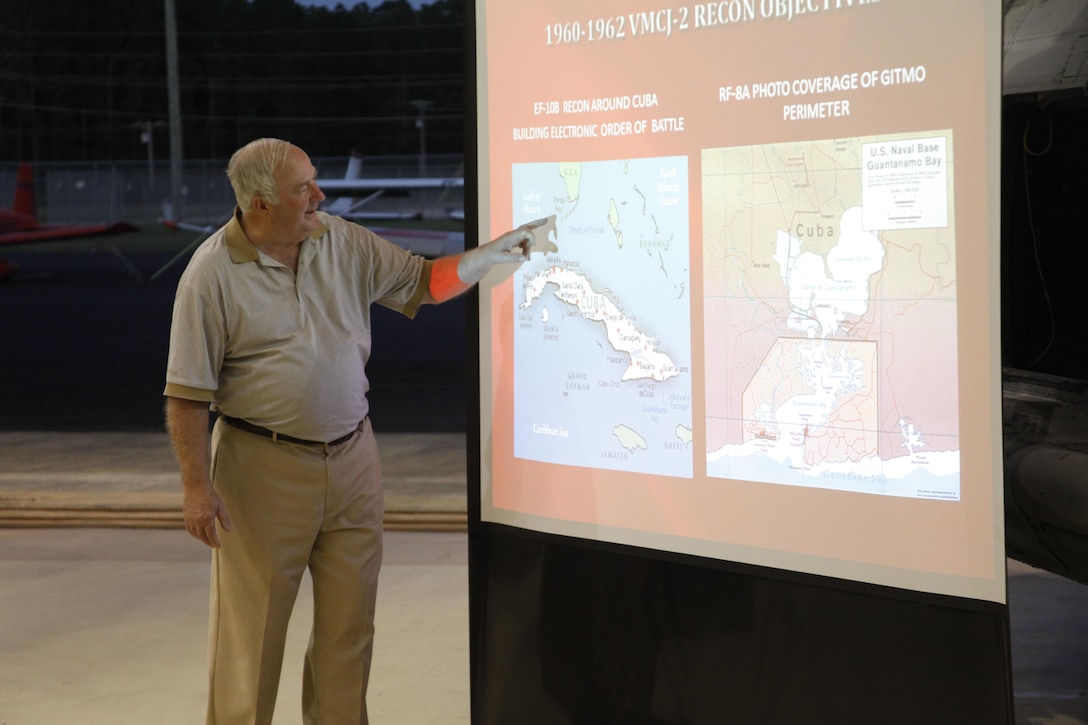 Retired Col. H. Wayne Whitten, a former Marine Composite Reconnaissance Squadron 2 pilot and author on the Cuban Missile Crisis, details on a map where VMCJ-2 flew to gather vital intelligence on the Soviet missile sites during the crisis. At an event commemorating fifty years since the Cuban Missile Crisis, Marines and civilians shared stories of life at a hangar in Havelock, N.C., Oct. 24. For their accomplishments before, during, and after the crisis, the squadron was awarded the first ever Navy Unit Citation medal not to be awarded during a time of war.