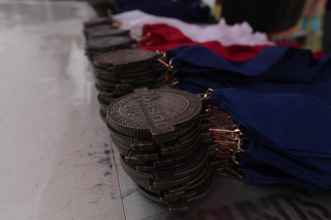 Following the 2012 Camp Pendleton Hard Corps Race Series, Buffalo Alley 10K race, medals were given to the top race finishers here, Oct. 20. The three-part event included a 1K Kid’s Race, 5K race and 10K race that took participants through backcountry trails where thriving herds of American Bison, commonly known as buffalo, still roam.