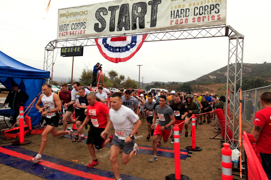 Competitors cross the starting line beginning their cross-country journey during the 2012 Camp Pendleton Hard Corps Race Series, Buffalo Alley 10K race here, Oct. 20. The event allowed participants to run through backcountry trails where thriving herds of American Bison, commonly known as buffalo, still roam.