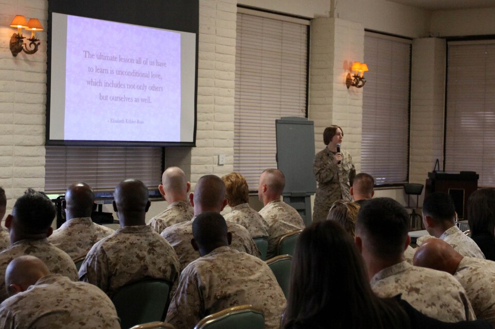 Sgt. Kiley D. Spurlock, the assistant operations chief for Marine Aircraft Group 39, shares her personal experiences with post-partum depression with a group Marines, sailors and families from 1st Marine Logistics Group during Operation Parenthood, an early childhood training at the Family Readiness Center here Oct. 31.