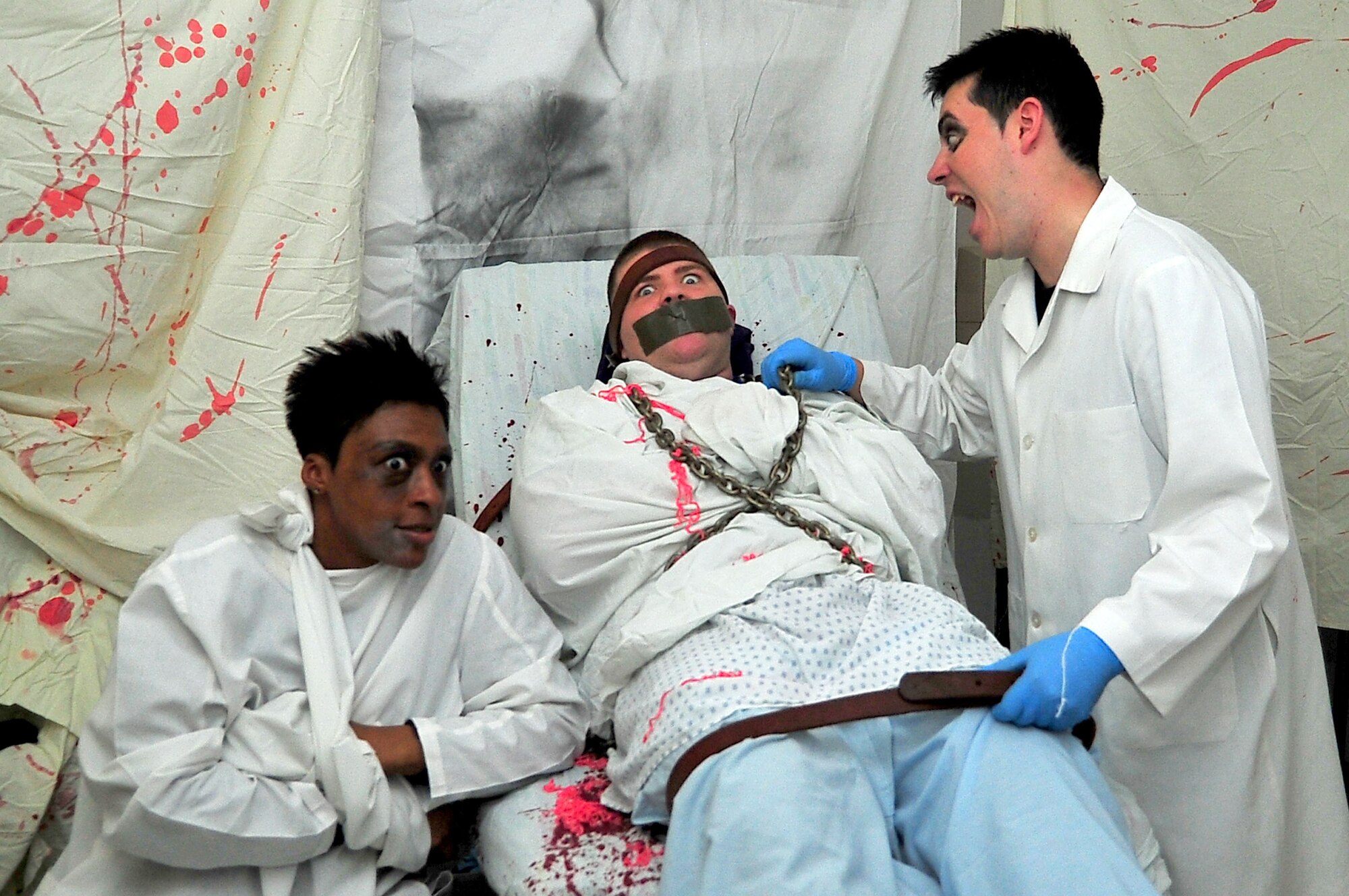 Service members prepare to scare visitors to the 51st Medical Group’s Haunted Hospital at Osan Air Base, Republic of Korea, Oct. 31, 2012. The haunted house included free entry, candy and a kid-friendly section. (U.S. Air Force photo/Tech. Sgt. Raymond Mills)
