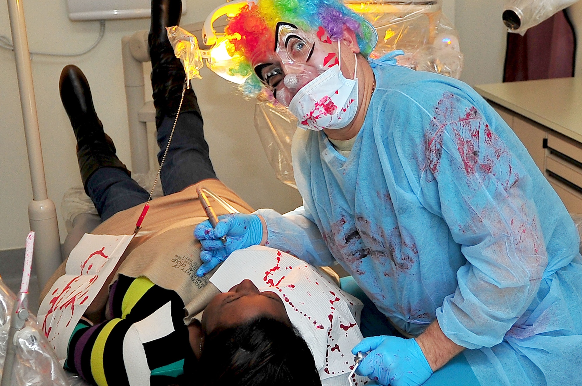 A demented dentist prepares to scare visitors to the 51st Medical Group’s Haunted Hospital at Osan Air Base, Republic of Korea, Oct. 31, 2012. The haunted house included free entry, candy and a kid-friendly section. (U.S. Air Force photo/Tech. Sgt. Raymond Mills)