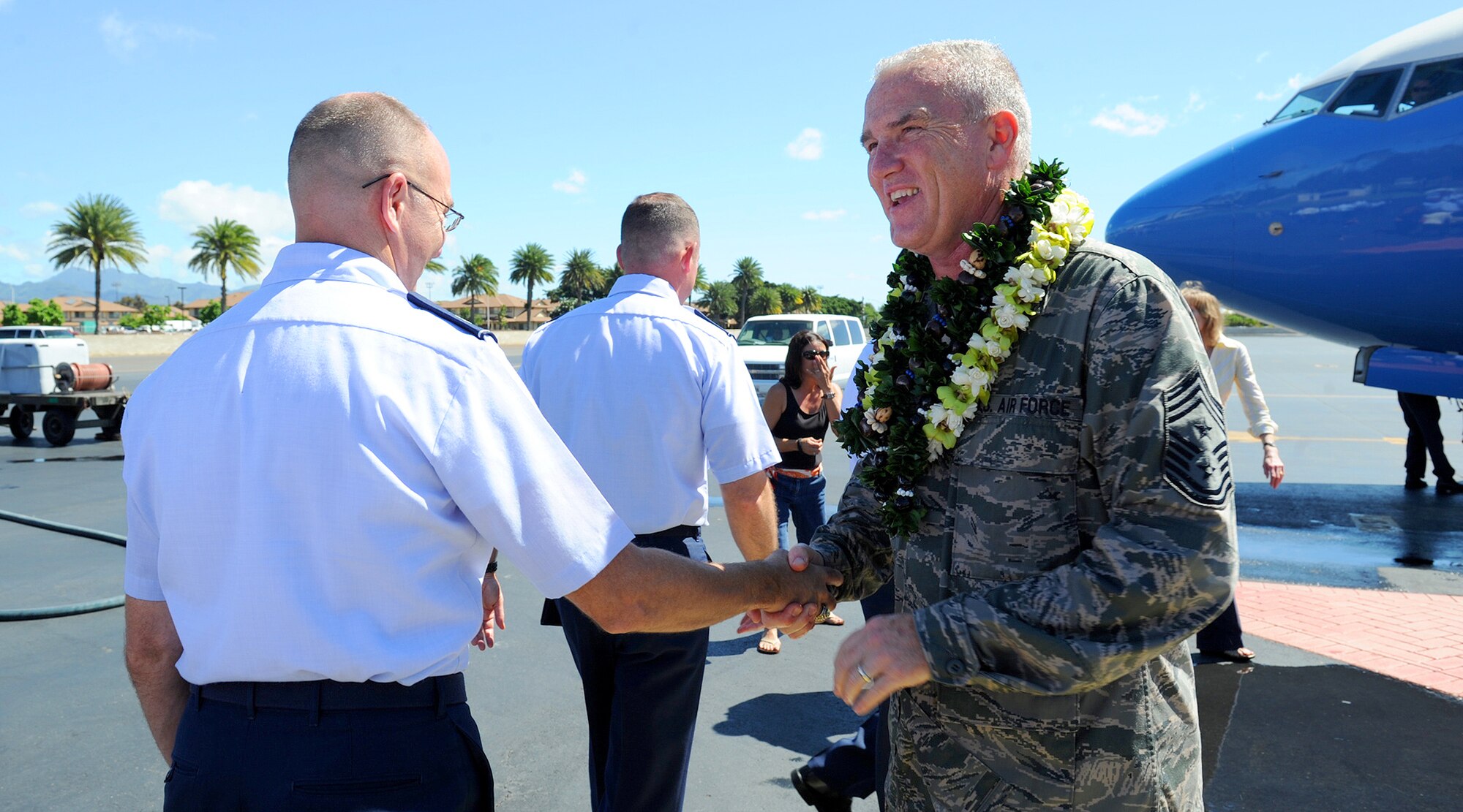 Pacific Air Forces airmen congratulate Chief Master Sgt. Brooke McLean, Pacific Air Forces command chief, after his “fini flight” at Joint Base Pearl Harbor Hickam-Hawaii, Oct. 29, 2012. McLean served 30 years in the Air Force and will retire Nov. 16, 2012 at JBPH-H, Hawaii. (U.S. Air Force photo/Tech. Sgt. Jerome S. Tayborn/Released)