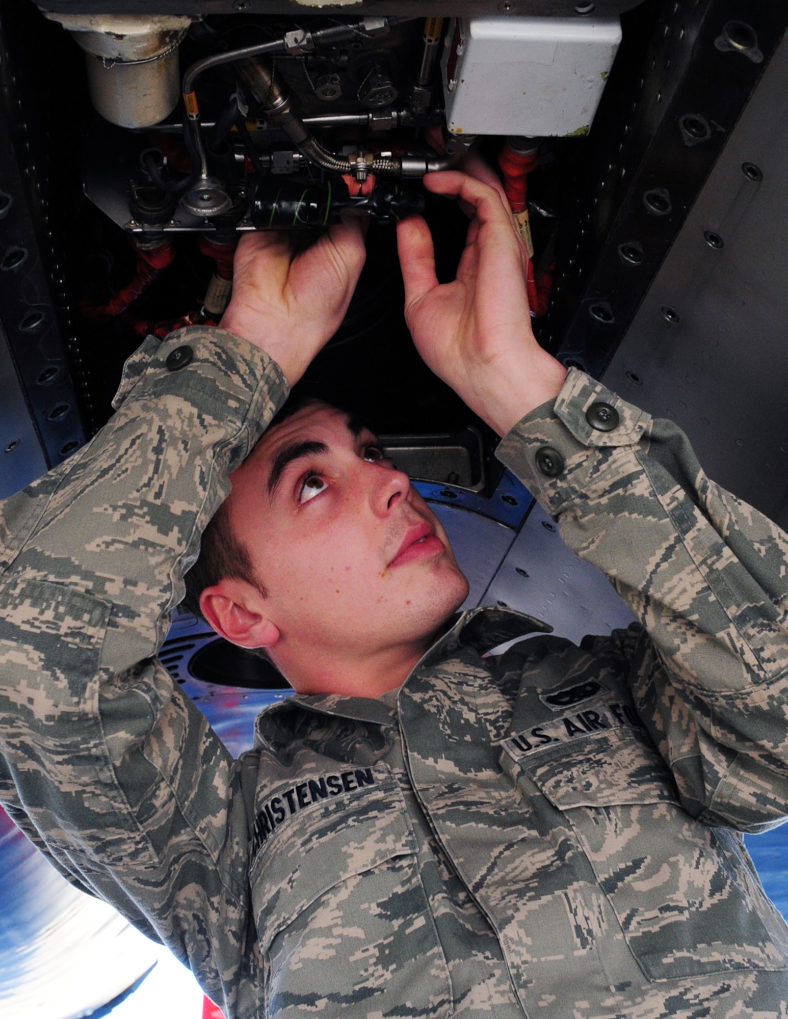 JOINT BASE ELMENDORF-RICHARDSON -- Senior Airman Devon Christensen, 44th Expeditionary Aircraft Maintenance Unit, installs electrical connectors on the jet fuel starter (JFS) of an F-15C Eagle. Airmen, aircraft, and equipment from Kadena Air Base, Japan, are deployed to Joint Base Elmendorf-Richardson supporting the Alaskan NORAD Region, part of the North American Aerospace Defense Command mission providing aerospace warning and control for North America. (U.S. Air Force photo/Master Sgt. Mikal Canfield)
