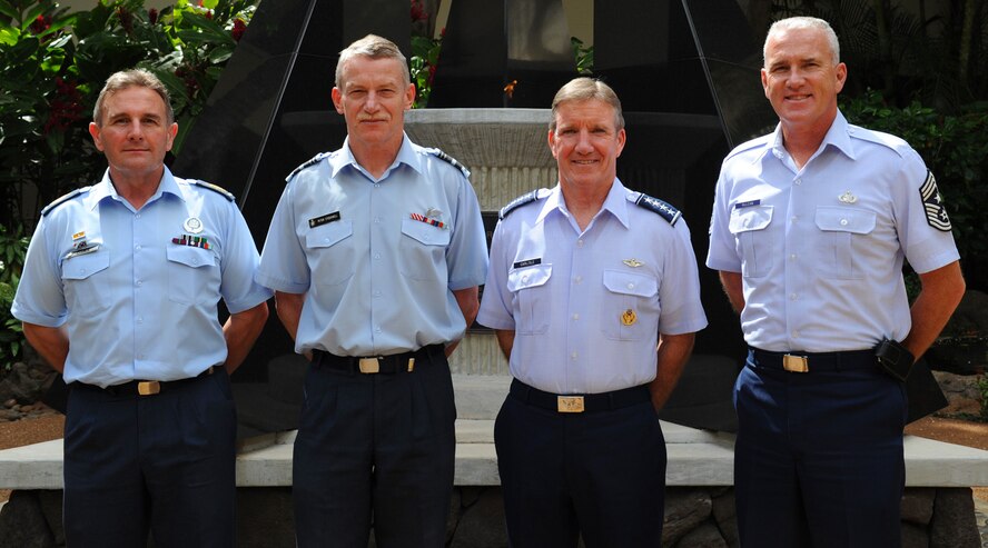 Warrant Officer Dennis Moratti, Warrant Officer of Royal New Zealand Air Force, Air Vice Marshal Peter Stockwell, Chief of Air Force, RNZAF, Gen. Herbert J. “Hawk” Carlisle, Pacific Air Forces commander, and Chief Master Sgt. Brooke McLean, PACAF command chief, pose for a group photo in front of the eternal flame at the Courtyard of Heroes, PACAF headquarters building, Joint Base Pearl Harbor-Hickam, Hawaii, Oct. 30, 2012. Air Vice Marshal Stockwell visited Hawaii to meet with Gen. Carlisle and senior leaders of PACAF to discuss common concerns and explore opportunities to strengthen regional cooperation.  (U.S. Air Force photo/Tech. Sgt. Jerome S. Tayborn/Released)