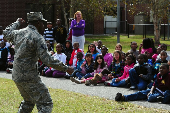 Tech. Sgt. Maurice Ferguson, 315th Aerospace Medicine Squadron, Drug Demand Reduction program manager, talks with students during Red Ribbon Week Oct. 30, 2012, at Hunley Park Elementary School, North Charleston, S.C. This year's theme is "The Best Me Is Drug Free." The campaign began after the 1985 murder of Federal Drug Enforcement Administration Agent, Enrique Camarena, while he was investigating Mexican drug traffickers. Red Ribbon Week allows educators, parents, community groups, students and others to focus on the work being done by the many who have pledged to live drug free. (U.S. Air Force photo/ Airman 1st Class Chacarra Walker)