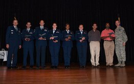 Col. Darren Hartford (left), 437th Airlift Wing commander, and Chief Master Sgt. Larry Williams (right), 437th Airlift Wing command chief, congratulate the 437th AW Quarterly award winners Oct. 25, 2012 at Joint Base Charleston - Air Base, S.C. Pictured from left to right is Senior Airman James Moreland, 437th Maintenance Squadron, Senior Master Sgt. Robert Schultz, 437th Aerial Port Squadron, Capt. Dianne Hanley, 437th APS, Senior Airman Joy Clayton, 16th Airlift Squadron, 2nd Lt. Andrea Gehrman, 437th Aircraft Maintenance Squadron, David Golzari, 437th MXS, and Rodney Wideman, 437th AMXS. Not pictured are TSgt Shawna Badillo and John Bowen, both from the 437th Operations Support Squadron. (U.S. Air Force photo/Airman 1st Class Ashlee Galloway) 

