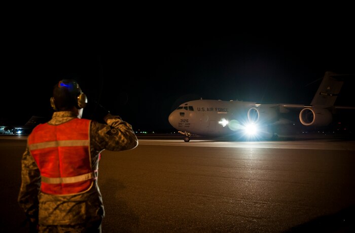 Staff Sgt. Lance Griffin, 305th Air Mobility Wing maintainer from Joint Base McGuire-Dix-Lakehurst, N.J., salutes the pilots as they depart from Joint Base Charleston to return to JB MDL to assist with Hurricane Sandy relief efforts Oct. 31, 2012. C-17 Globemaster IIIs from JB MDL and Dover Air Force Base, Del., landed here over the weekend because of the intensity of Hurricane Sandy affecting the Northeast. (U.S. Air Force photo/Senior Airman Dennis Sloan)