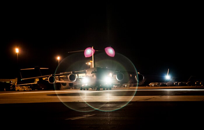 Crew members with the 305th Air Mobility Wing from Joint Base McGuire-Dix-Lakehurst, N.J., depart from Joint Base Charleston to return to JB MDL to assist with Hurricane Sandy relief efforts Oct. 31, 2012. C-17 Globemaster IIIs from JB MDL and Dover Air Force Base, Del., landed here over the weekend because of the intensity of Hurricane Sandy affecting the Northeast. (U.S. Air Force photo/Senior Airman Dennis Sloan)