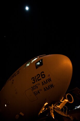Crew members with the 305th Air Mobility Wing from Joint Base McGuire-Dix-Lakehurst, N.J., perform pre-flight checks on their C-17 Globemaster III before departing from Joint Base Charleston to return to JB MDL to assist with Hurricane Sandy relief efforts Oct. 31, 2012. C-17 Globemaster IIIs from JB MDL and Dover Air Force Base, Del., landed here over the weekend because of the intensity of Hurricane Sandy affecting the Northeast. (U.S. Air Force photo/Senior Airman Dennis Sloan)