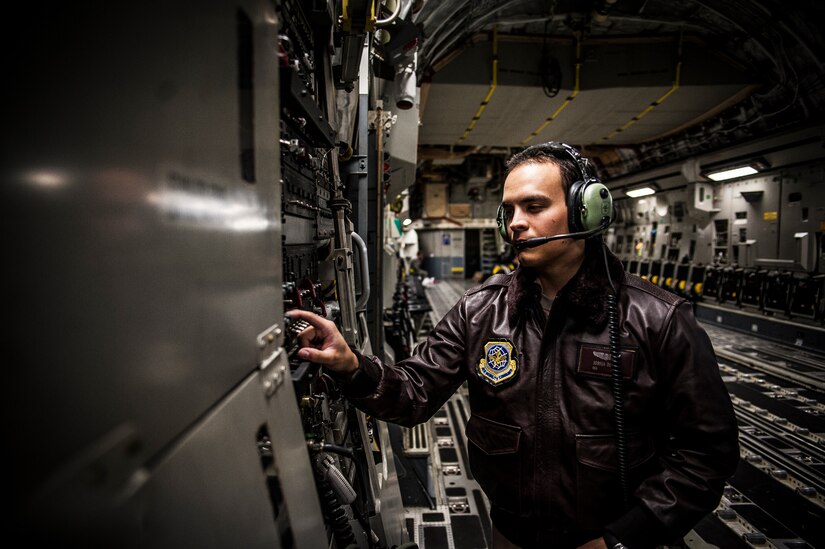 Senior Airman Joshua Doest, 305th Air Mobility Wing C-17 Globemaster III loadmaster from Joint Base McGuire-Dix-Lakehurst, N.J., performs pre-flight checks on the aircraft before departing from Joint Base Charleston to return to JB MDL to assist with Hurricane Sandy relief efforts Oct. 31, 2012. C-17 Globemaster IIIs from JB MDL and Dover Air Force Base, Del., landed here over the weekend because of the intensity of Hurricane Sandy affecting the Northeast. (U.S. Air Force photo/Senior Airman Dennis Sloan)