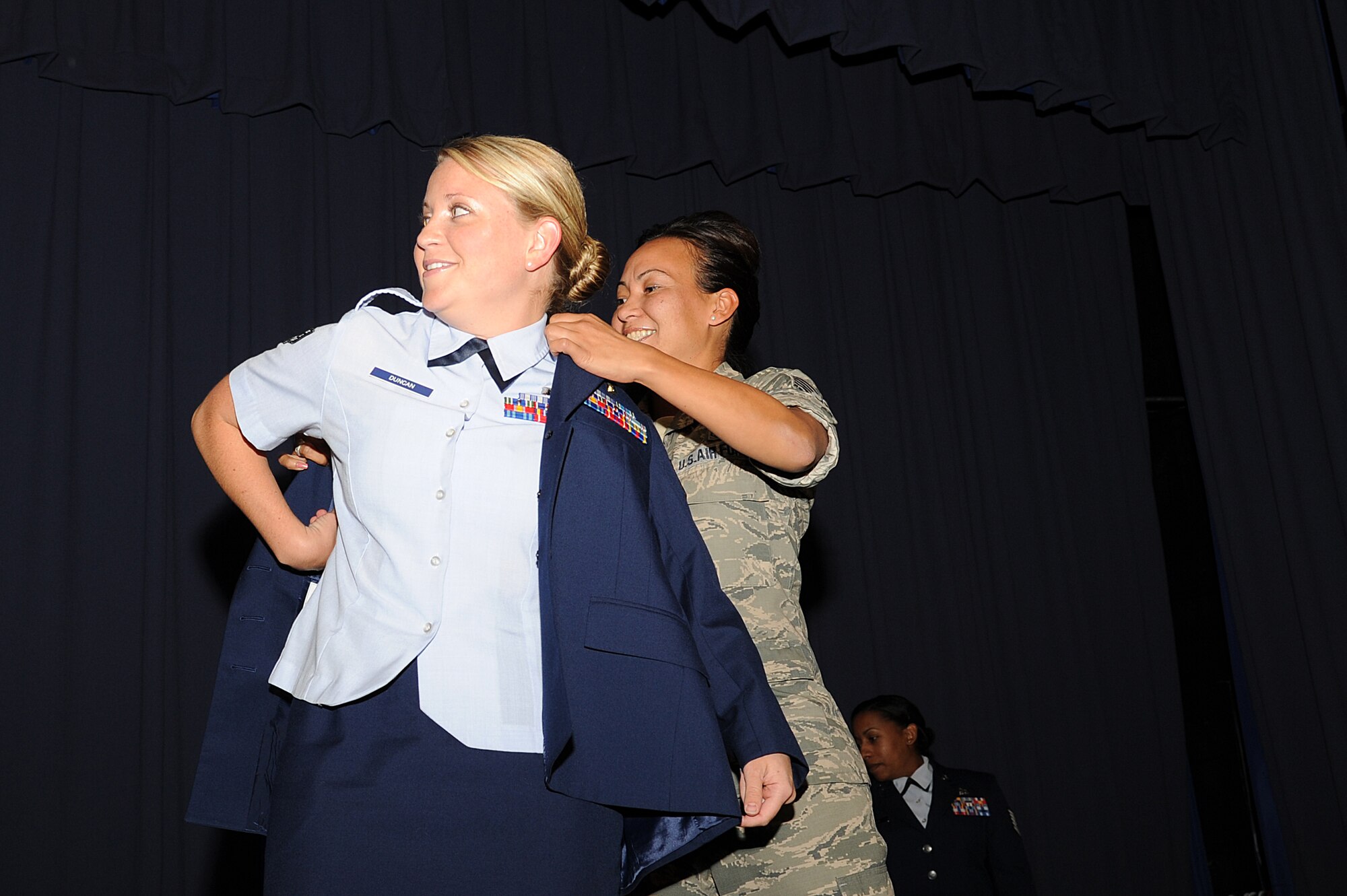 U.S. Air Force Staff Sgt. Tracy Duncan, a pharmacy technician with 1st Special Operations Medical Support Squadron, joins the NCO corps during an NCO recognition ceremony at the King Auditorium on Hurlburt Field, Fla., Oct. 30, 2012. During the NCO recognition ceremony the Airmen put on their staff sergeant stripes for the first time. (U.S. Air Force Photo/Airman 1st Class Michelle Vickers)