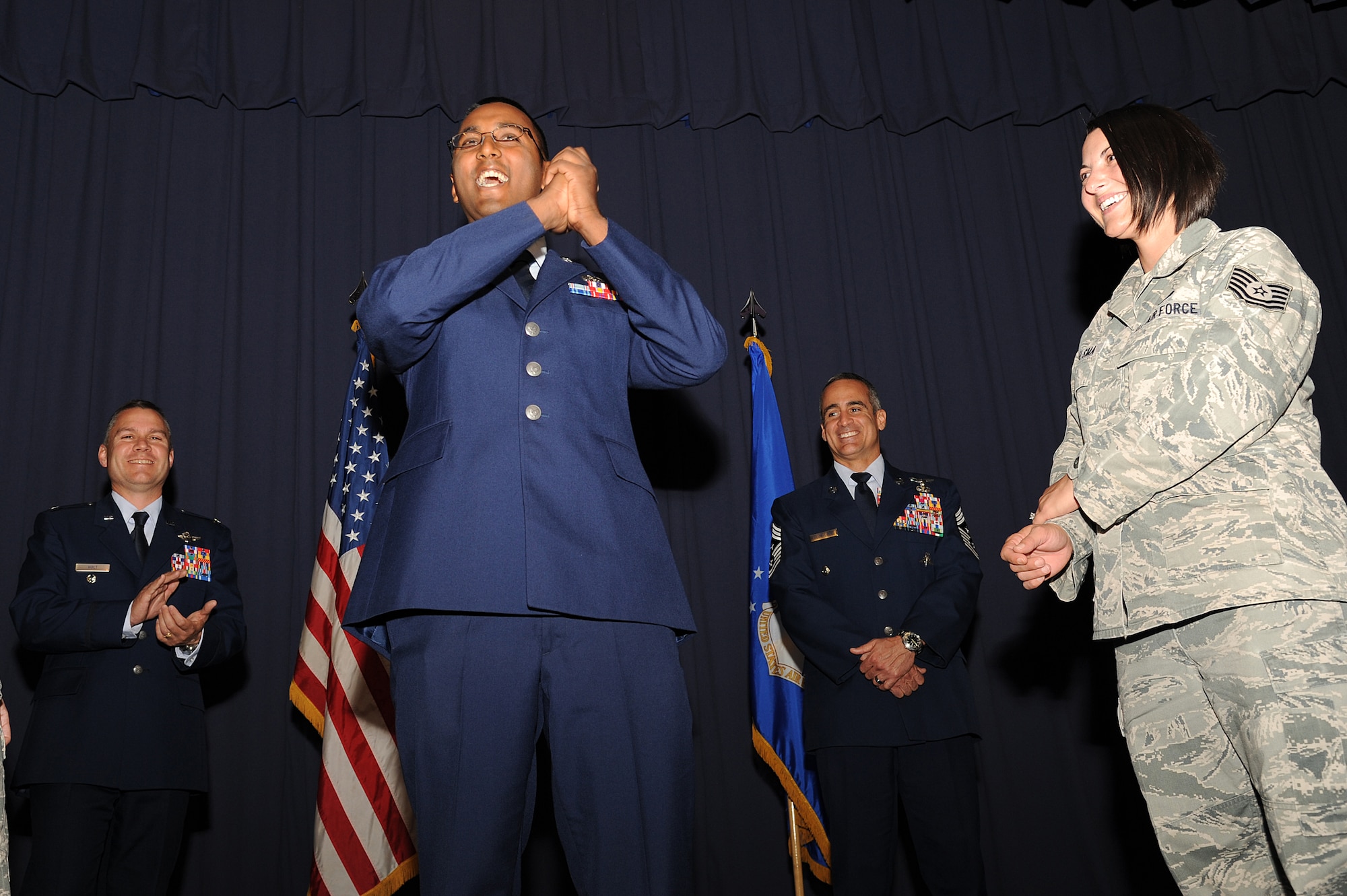 U.S. Air Force Staff Sgt. Alexander Prasadi, a maintenance database manager with 1st Special Operations Medical Operations Squadron, celebrates his promotion to staff sergeant during an NCO recognition ceremony at the King Auditorium on Hurlburt Field, Fla., Oct. 30, 2012. The NCO recognition ceremony welcomes new staff sergeants to the NCO tier. (U.S. Air Force Photo/Airman 1st Class Michelle Vickers)