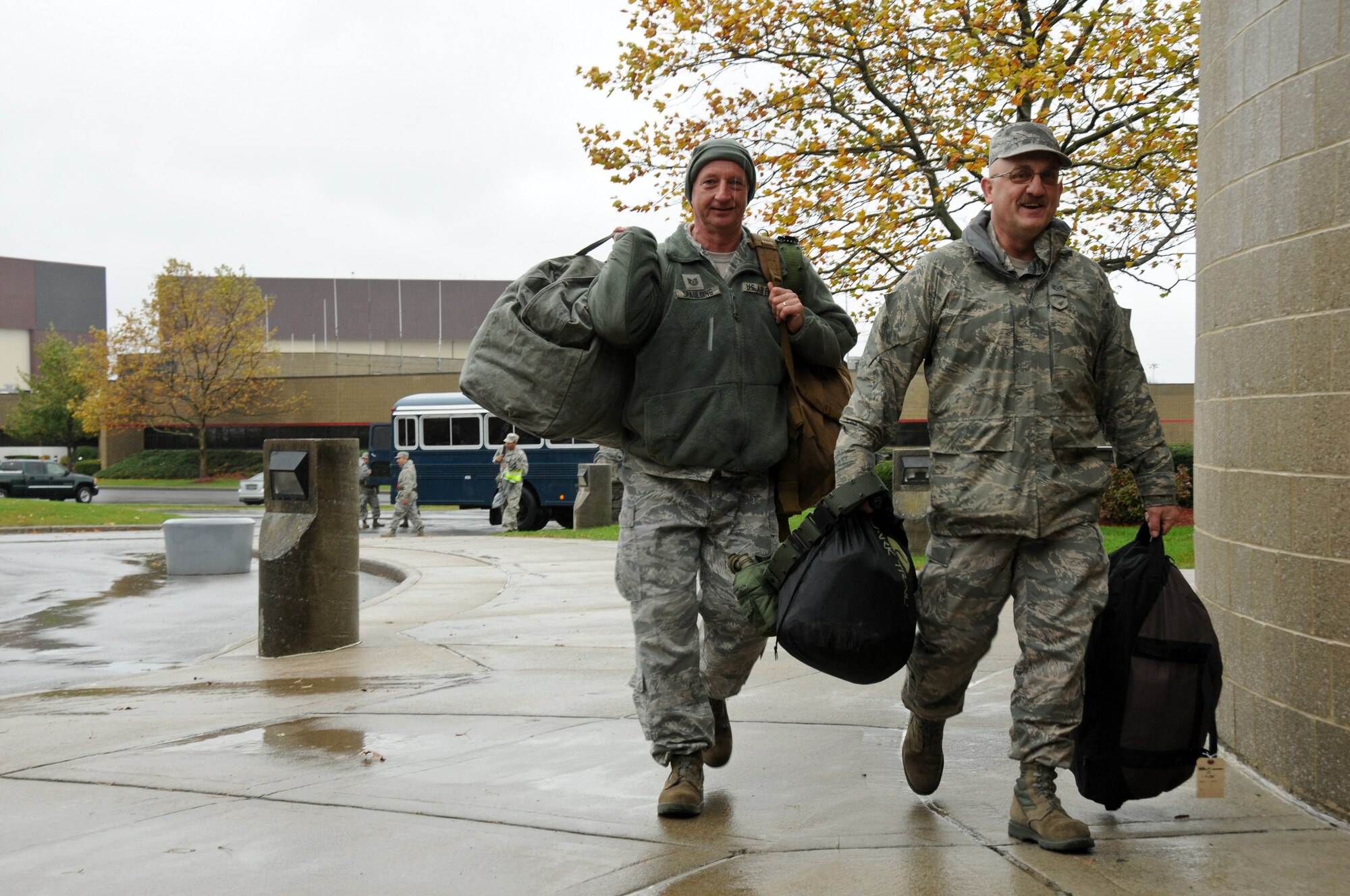 STEWART ANGB, Newburgh, NY --New York Air National Guard Tech. Sgt's. Robert Spaulding and Daryl McKinnon of the 105th Airlift Wing arrive at the 105th Force Support Squadron Personnel Deployment Function as part of the New York State response to Hurricane Sandy on Monday, Oct. 29. The airmen are among more than 1,100 Army and Air National Guard Soldiers and Airmen deployed at the order of New York Governor Andrew M. Cuomo to respond to the storm. (National Guard photo by Tech. Sgt. Michael OHalloran)(Released)